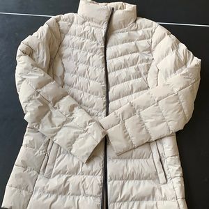 A tan puffer jacket, size large